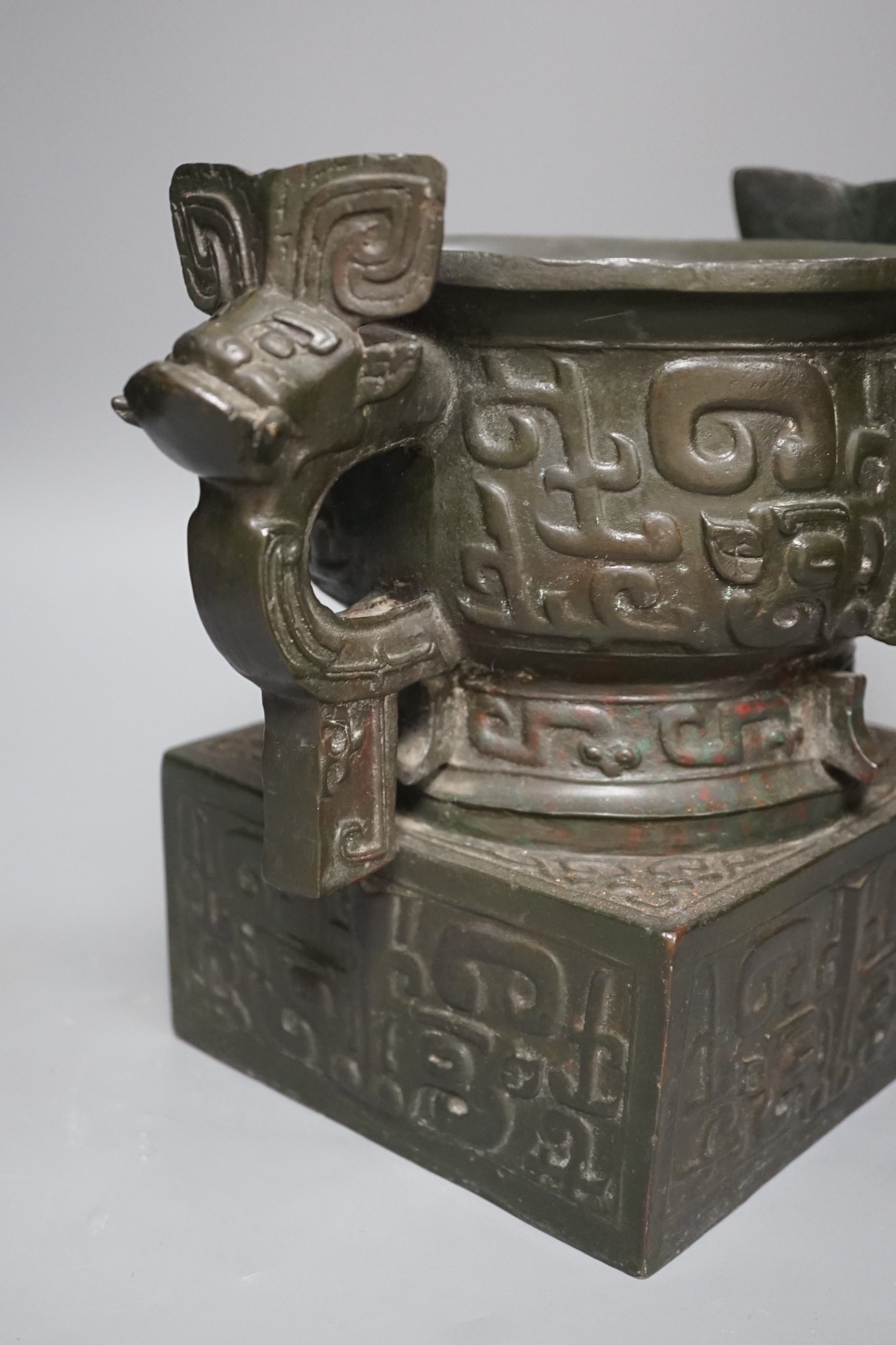 An archaistic Chinese bronze vase after the antique, modelled as an original bronze in the collection of the Palace Museum, Beijing, boxed with certificate, cast number 35. 25.5cm tall